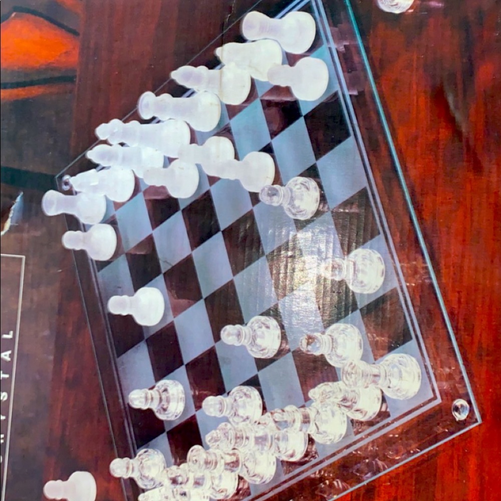 This is a glass chess game unbroken comes with box never played or never touched
